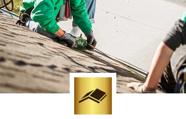 Two people work on a sloped roof, one measuring with a tape measure while wearing gloves. A gold square icon with a black roof symbol and the phrase "Exterior Done Best" highlights the commitment to quality roofing in the Twin Cities.